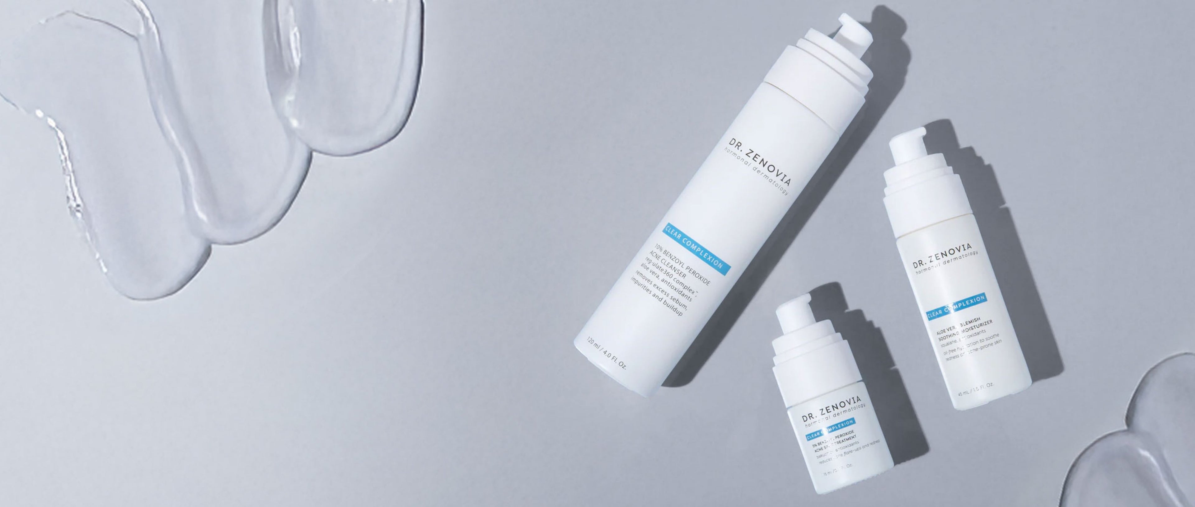 Dr. Zenovias Clear Complexion line with product smears on the edges and a gray background.