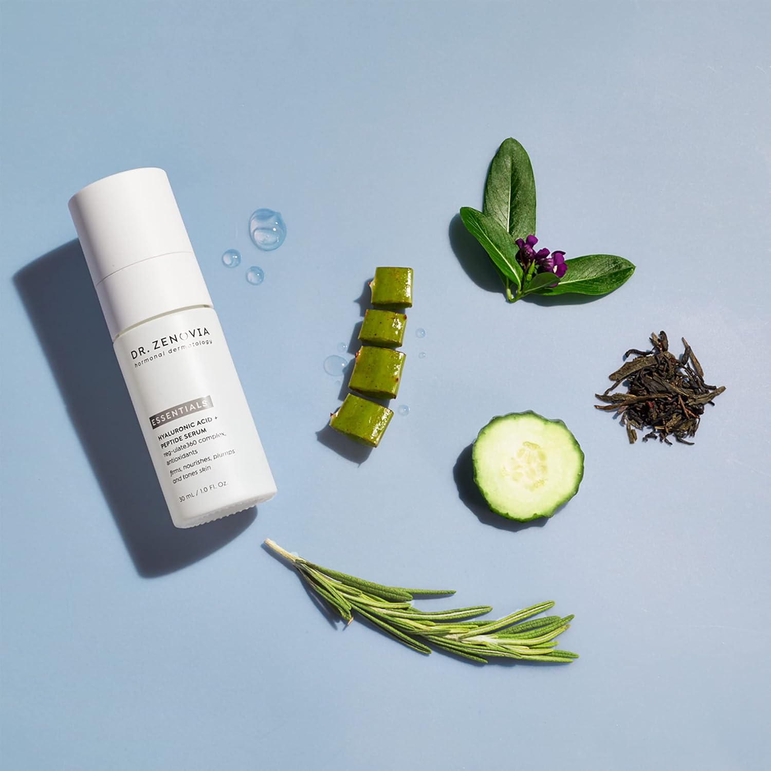 Skincare bottle with natural ingredients on a light blue background