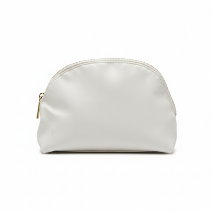 Front view of cream faux leather cosmetic bag with gold zipper closure on white background