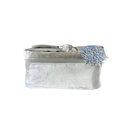Gray fabric bag with decorative blue clasp on a white background