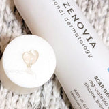 Demonstration of the scar gel being applied to a cap, highlighting its smooth texture and ease of use for treating acne scars and other skin imperfections.