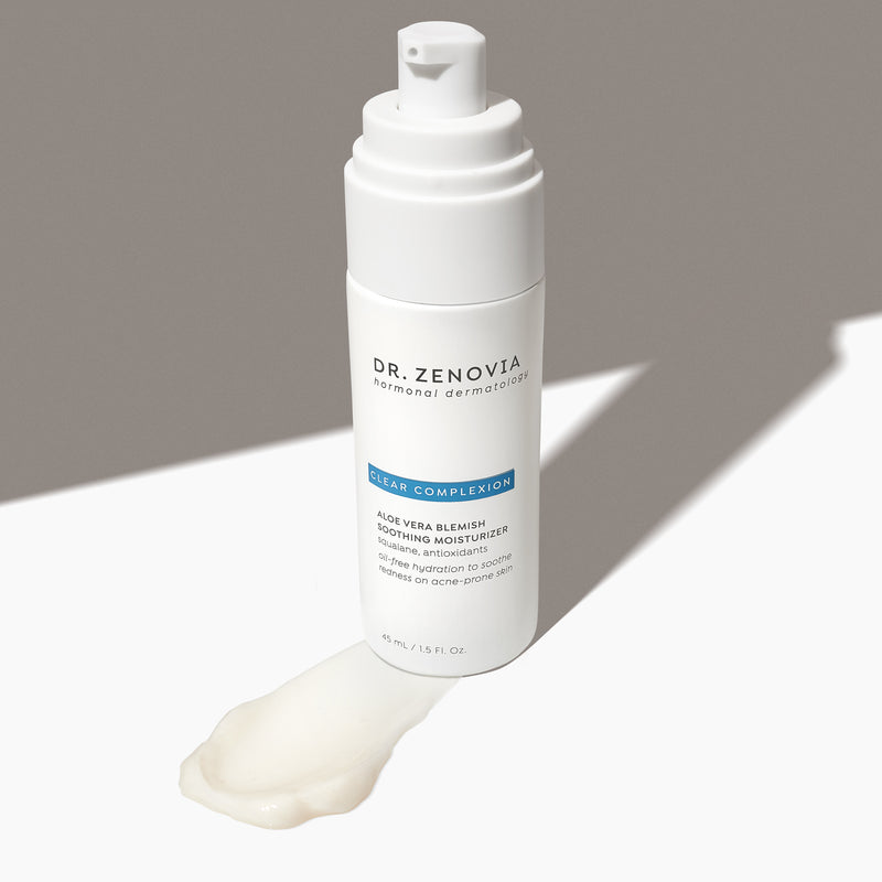Angled view of Dr. Zenovia Aloe Vera Blemish Soothing Moisturizer bottle with pump and a smear of its gel-cream formula